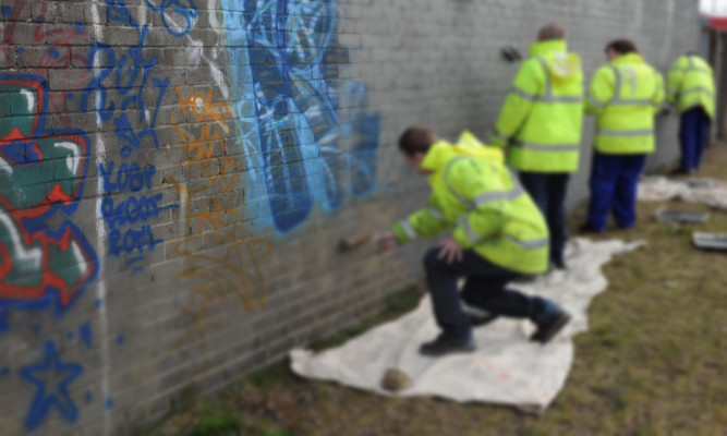 Offenders carrying out community payback work in Dundee.