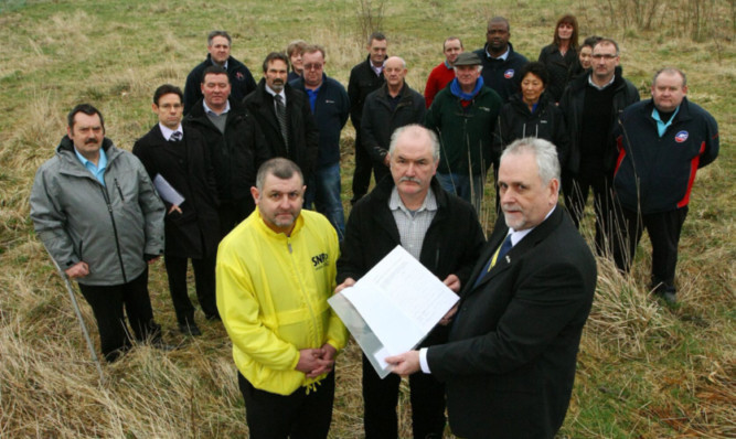 Craig Walker, SNP candidate in the Glenrothes West and Kinglassie by-election, Stuart Dunn and Bill Brown, holding the petition, with representatives from the businesses in the area.