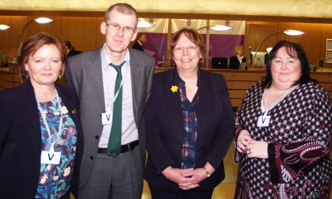 At the Scottish Parliament, from left: Kate Sanger, Ian Hood, Alison McInnes MSP and Beth Morrison.