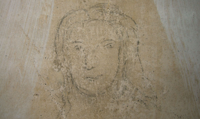 The pencil sketch drawing of the mystery woman.