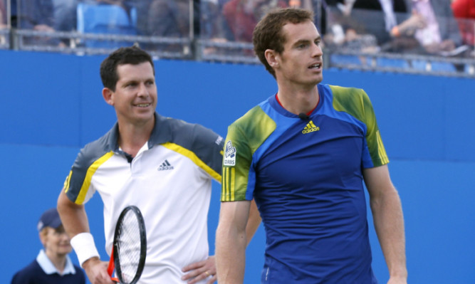 Andy Murray is now eager to surpass the achievements of Tim Henman (left) after matching his fellow Briton's career-wins record.