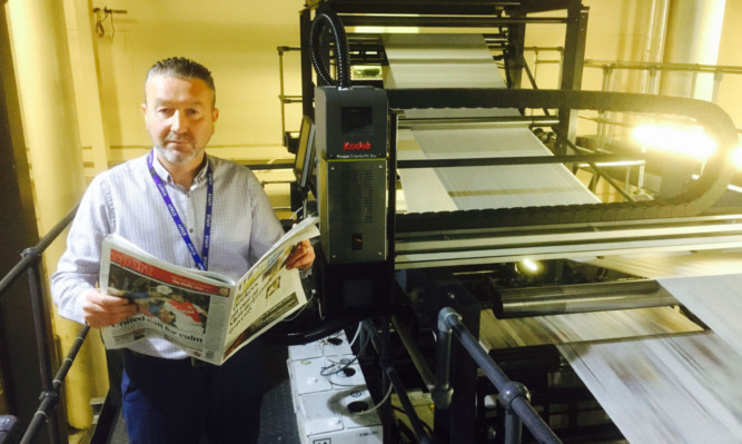 Guy Forester, head of operations (newspapers), prepares for the Courier Code competition on Saturday. Every reader has the chance to win £500.