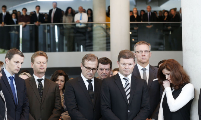 Lufthansa employees hold a minute of silence in Frankfurt.