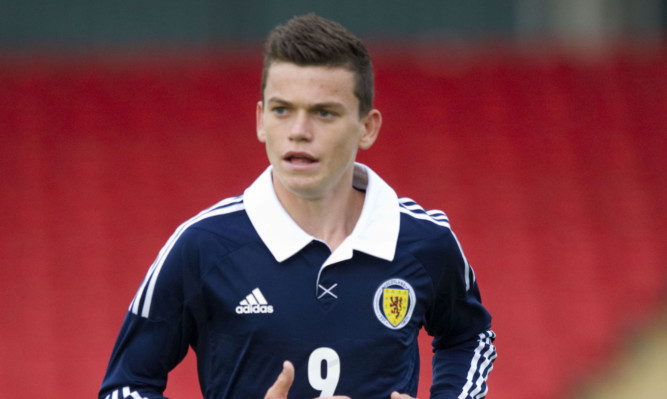 Jack Harper in action for Scotland.