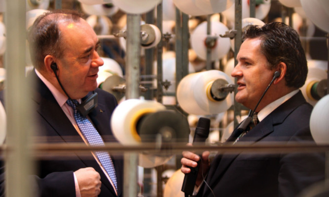 Former First Minister Alex Salmond speaks with Scott and Fyfe chief executive John Lupton during a factory tour.