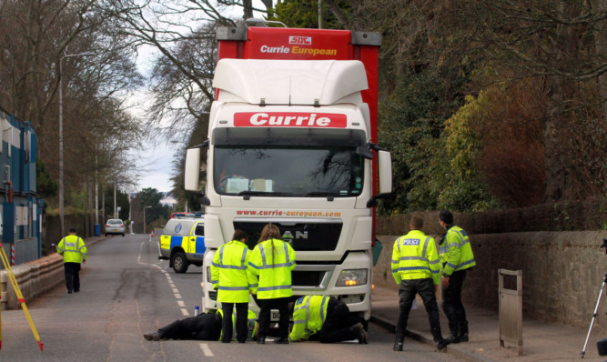 Police at the scene of the accident opposite the site entrance to Harris Academy.