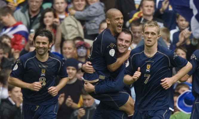 Will we see the likes again? Scotland's Kris Boyd (10) congratulated after scoring by Paul Hartley (8), Darren Fletcher (7) and Nigel Quashie in a 6-0 win over the Faroe Islands in 2006.