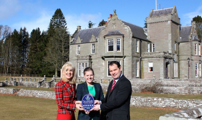 House of Turin owner Yvonne Corbett, left, and colleague Kate Kenyon receiving the award from Dennis McFarlane, VisitScotlands industry relationship manager.