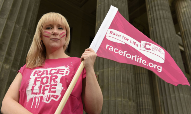 Aimi Munro flies the flag for the Race for Life.