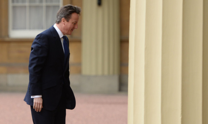 David Cameron visiting Buckingham Palace to request a formal dissolution of parliament.