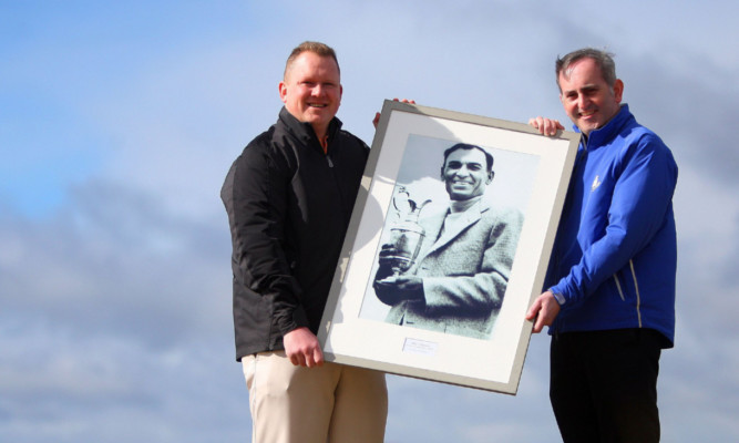 Senior assistant professional Nikki Christie and head professional Colin Sinclair with an old picture of Ben Hogan at Carnoustie Golf Course.