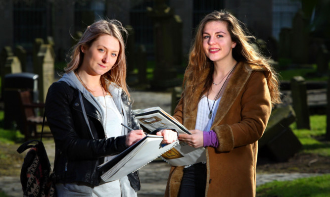 Students Trudi McVey, left, and Eleanor Begg with their sketch pads at the Howff cemetery, Dundee.