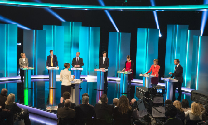 SALFORD, ENGLAND - APRIL 2: (EDITORIAL USE ONLY. NO MERCHANDISING. NO ARCHIVE AFTER MAY 02, 2015)  In this handout provided by ITV, (L-R): Green Party leader Natalie Bennett, Liberal Democrat leader Nick Clegg, UKIP leader Nigel Farage, Labour leader Ed Miliband, Plaid Cymru leader Leanne Wood, Scottish National Party leader Nicola Sturgeon and British Prime Minister and Conservative leader David Cameron take part in the ITV Leaders' Debate 2015 at MediaCityUK studios on April 2, 2015 in Salford, England. Tonight sees a televised leaders election debate between the seven political party leaders. The debate will be the only time that David Cameron and Ed Miliband will face each other before polling day on May 7th.  (Photo by Ken McKay/ITV via Getty Images)