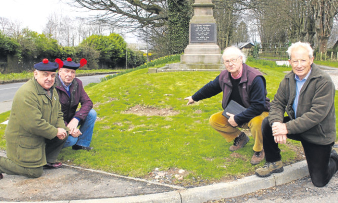 From left: Major Ronnie Proctor, Black Watch Association member John Campbell, community council member Dudley Treffry and resident Peter Robertson at the war memorial.