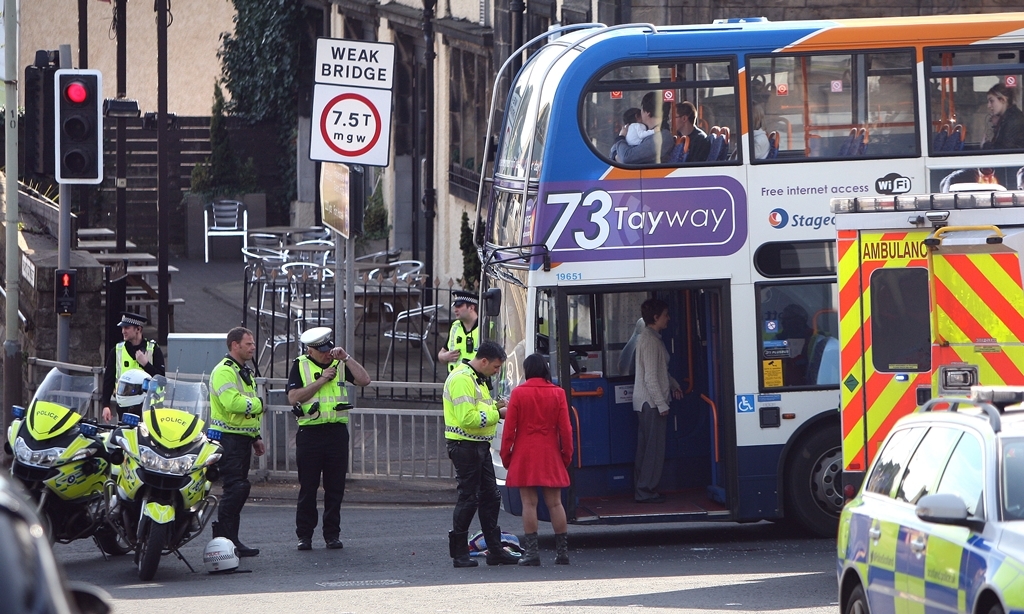 Kris Miller, Courier, 06/04/15. Picture today at the junction of Fort Street and Queen Street, Broughty Ferry where a female pedestrian (young woman) was involved in a collision with a Stagecoach 73a bus bound for Carnoustie. Pic shows police interviewing witnesses.