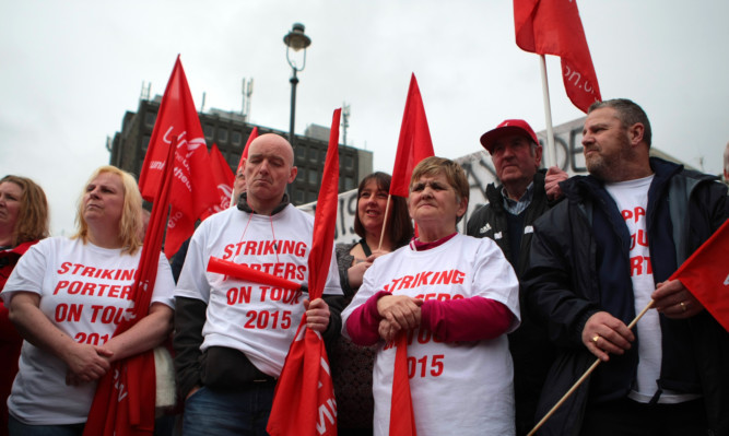 Members of the Unite union at an earlier protest over porters pay at Dundee hospitals.