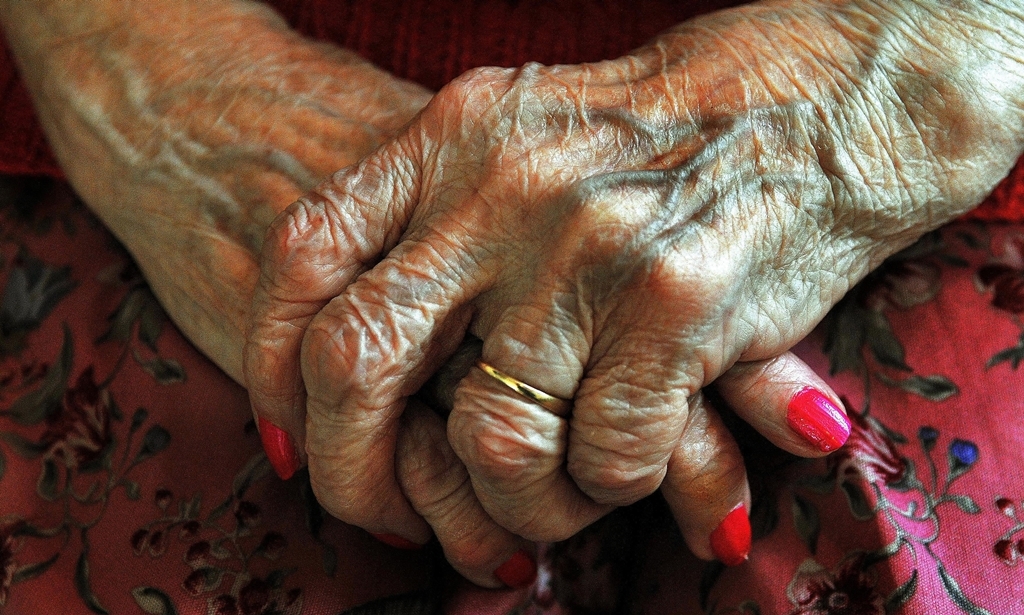 File photo dated 05/12/08 of the hands of an elderly woman, research today shows that retired people are having to find more than £400 a year extra just to keep up with rises in the cost of living. PRESS ASSOCIATION Photo. Issue date: Wednesday January 13, 2010. The cost of living for households where the main occupant is aged 65 to 74 has risen by 1.89% or £429 during the past 12 months, according to retirement income group MGM Advantage. See PA story MONEY Pensioners. Photo credit should read: John Stillwell/PA Wire
