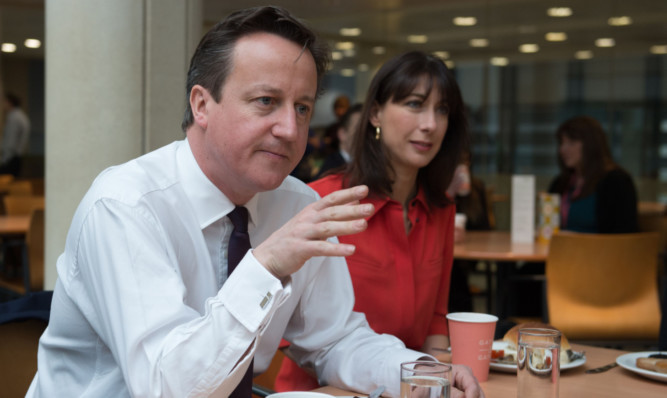 David Cameron and his wife Samantha have breakfast with staff at the insurance and pensions company Scottish Widows at their headquarters in Edinburgh.