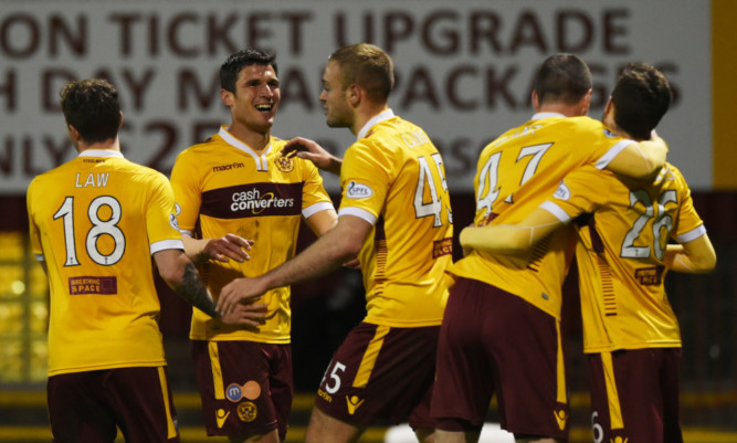John Sutton celebrates his second goal for Motherwell.