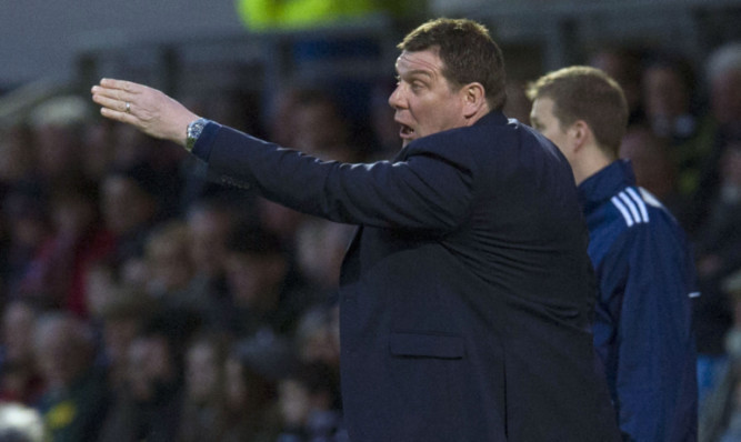 St Johnstone Manager Tommy Wright gives out instructions from the dugout.