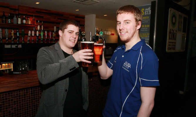 Iain MacKinnon, right, does not think raising the drinking age is a good idea.