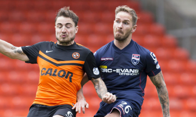 Martin Woods battles with Paul Paton.