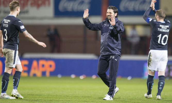 Dundee boss Paul Hartley (centre) celebrates at the end of the game.
