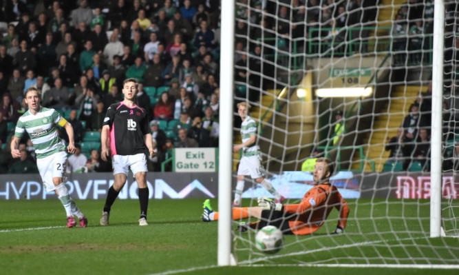 Celtic's Stefan Johnasen fires the ball into the net.