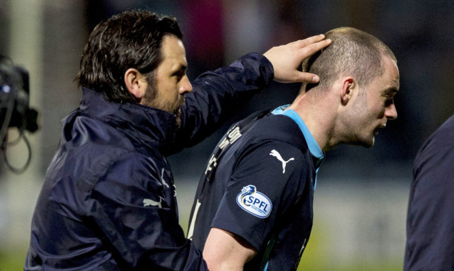 Dundee manager Paul Hartley with James McPake at full-time.