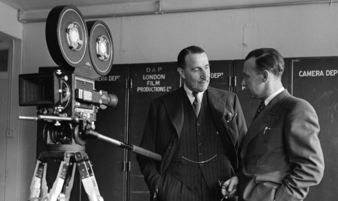 J Arthur Rank chats with Bert Easy, head of the Pinewood Studios Camera Department in 1946.