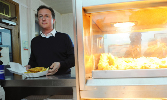 David Cameron stops off for fish and chips on the campaign trail in Cumbria.