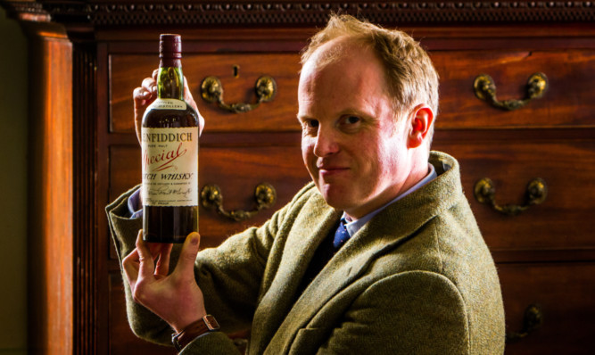 Nick Burns with one of the rare bottles of whisky.