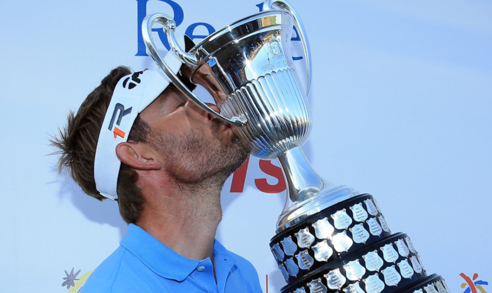 Raphael Jacquelin celebrates finally getting his hands on the trophy.