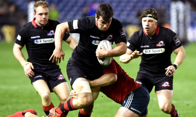 Stuart McInally, centre, is challenged by Munsters Felix Jones, left, and Donnacha Ryan.