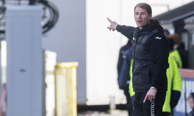 Alan Archibald instructs his team from the sidelines.