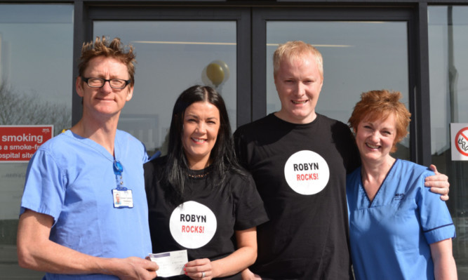 Dr Graham Tydeman, Alison and Rob Askew, and fetal medicine midwife Isobel Clegg.