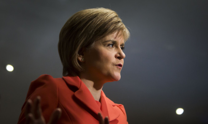 First Minister Nicola Sturgeon during a TV interview at the Saporito Café, while on the campaign trail in Paisley.