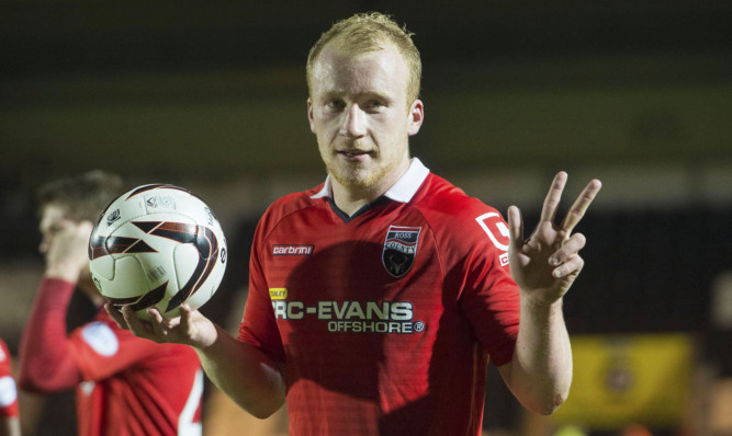 Liam Boyce collects the match ball.