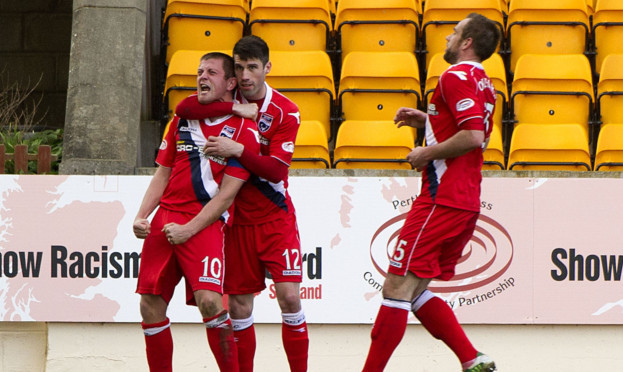 Countys Richie Brittain celebrates equalising for a second time.