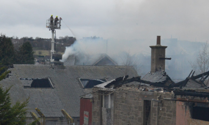 Firefighters damping down remaining hotspots on Tuesday morning.