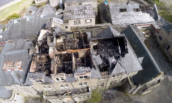 A still from drone footage showing the roof damaged by Monday's fire.