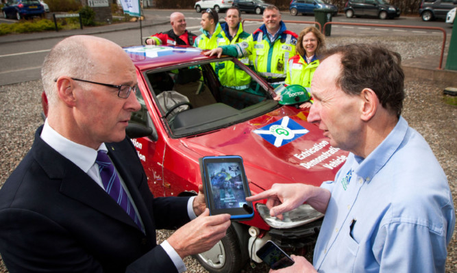 John Swinney MSP chats to Dr Colville Laird (medical director of BASICS Scotland) at the launch.