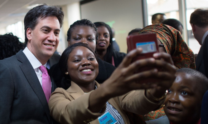 Labour Party leader Ed Miliband meets members of the Praise House Community Church in Croydon, south London.