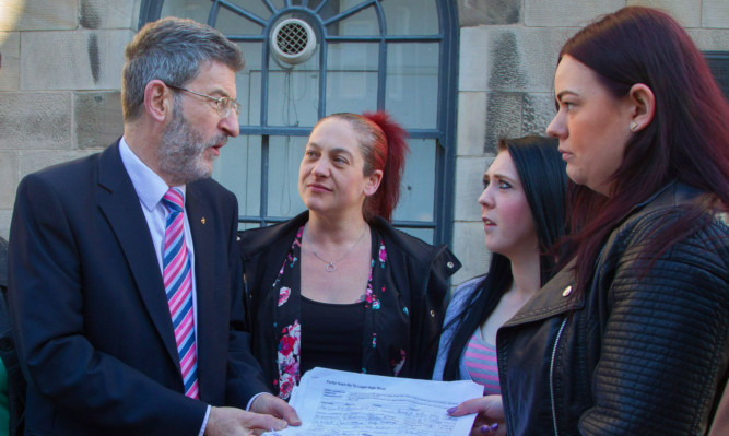 Nigel Don receives the petition from, from left, Nikki Leasley, Adele Speirs and Bobbi Murray.