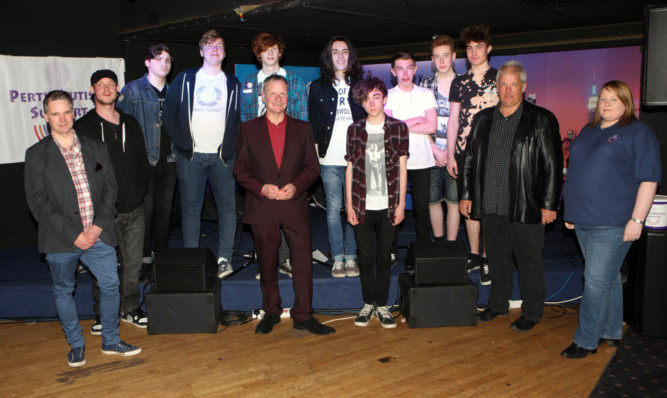 Musicians who took part in a bands event in aid of Autism Support in Perth with judges Sandy Fyfe, left, Pete Wishart, centre, and Scott McIntyre, second right, and Angie Ferguson of Autism Support.