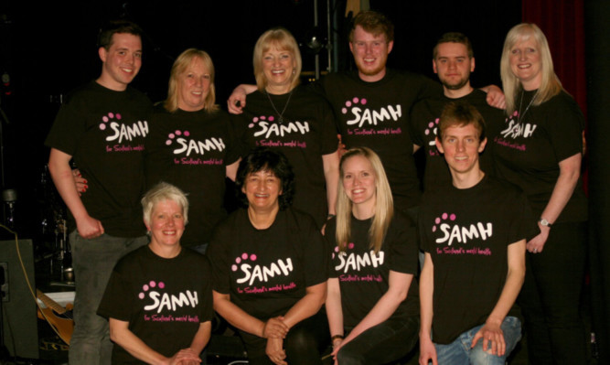 Rosss mum Sandra, back, third from left, joins friends and supporters of SAMH at the concert.