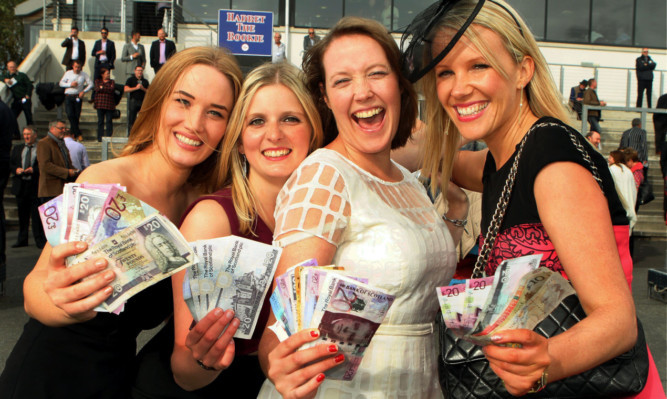 Kirsty Mackay, Lynne Strachan, Jo Harrison and Amanda Whyte, from Aberdeen, celebrate their winnings at the racecourse last year.