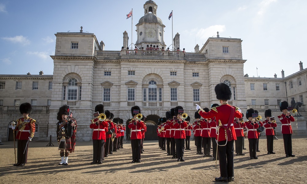 LONDON, ENGLAND - MARCH 23:  The Irish Guards march onto Horse Guards Parade during the official launch of this summer's Beating Retreat on March 23, 2015 in London, England.  An original Waterloo Bugle, recovered from the battlefield alongside a Drummer and his book of bugle calls, will be played for the first time in 200 years during the summer concert, held on the 10th and 11th of June to commemorate the 200th anniversary of the Battle of Waterloo. (Photo by Rob Stothard/Getty Images)