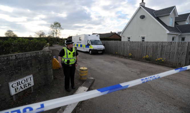 Police activity outside the houses in Croft Park after a body was discovered.