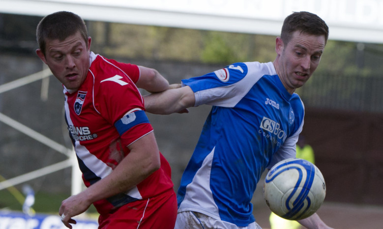 Richard Brittain (left) jostles with St Johnstone's Steven MacLean.